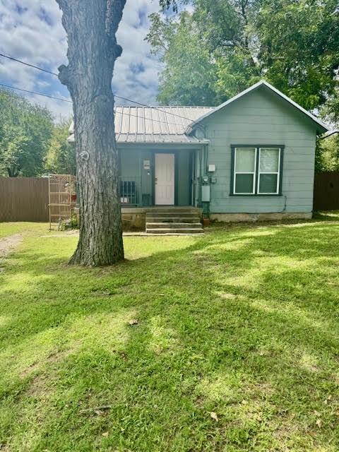 715 W Ball St, Weatherford, TX 76086 - back of property featuring a metal roof and a standing seam roof