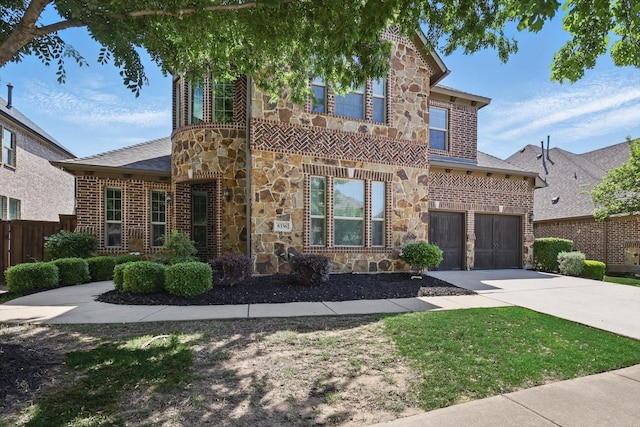 8336 Pitkin Rd, Frisco, TX 75036 - view of front of home featuring stone siding, concrete driveway, and brick siding