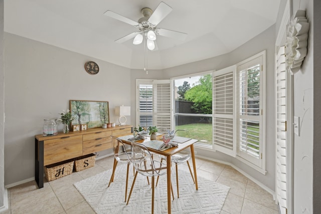 dining room featuring light tile patterned floors, ceiling fan, and baseboards