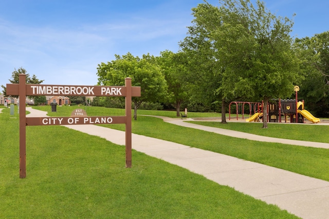 view of community featuring a lawn and playground community