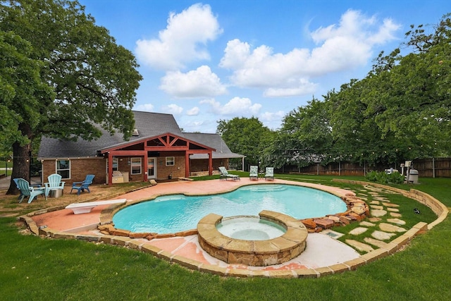 view of swimming pool featuring fence, a fenced in pool, an in ground hot tub, a patio area, and a yard