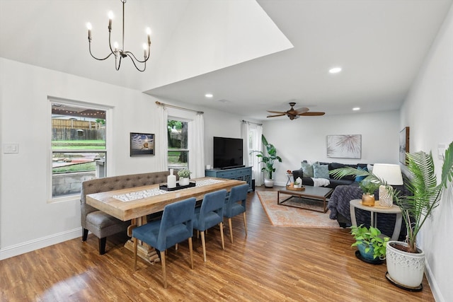 dining room featuring recessed lighting, baseboards, wood finished floors, and ceiling fan with notable chandelier