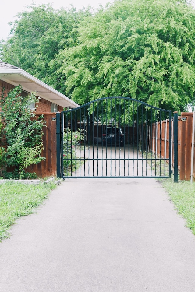 view of gate featuring fence