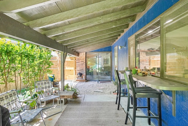 view of patio featuring fence