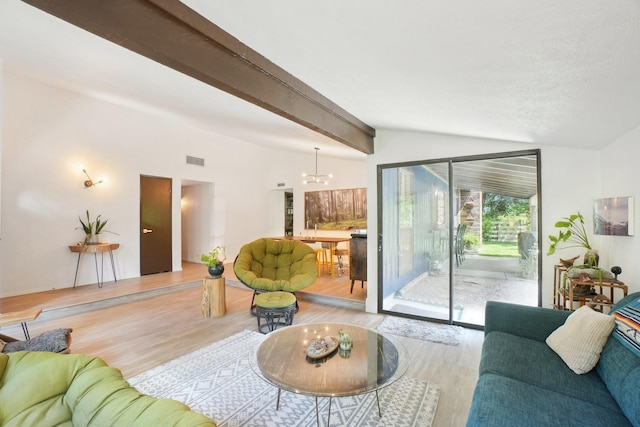 living area featuring a notable chandelier, vaulted ceiling with beams, visible vents, and light wood-style flooring