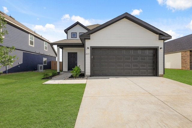 2433 Dahlia Dr, Fort Worth, TX 76123 - view of front facade featuring a front yard, driveway, and a garage
