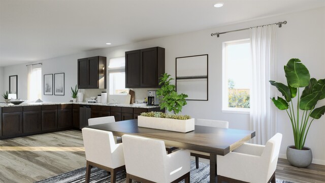 dining room featuring recessed lighting, light wood-style flooring, and plenty of natural light