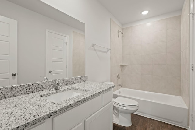 2433 Dahlia Dr, Fort Worth, TX 76123 - full bath featuring toilet, wood finished floors, shower / washtub combination, vanity, and recessed lighting