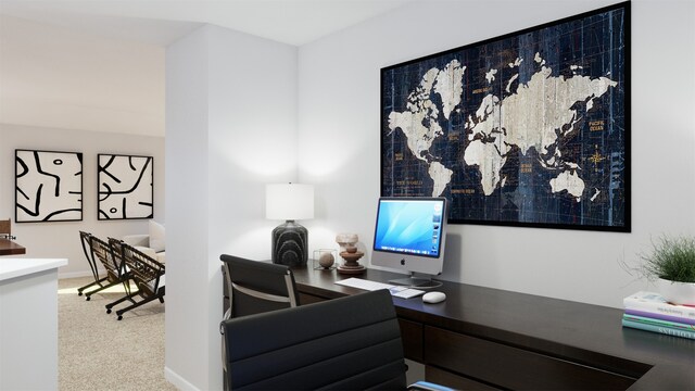 carpeted office featuring baseboards