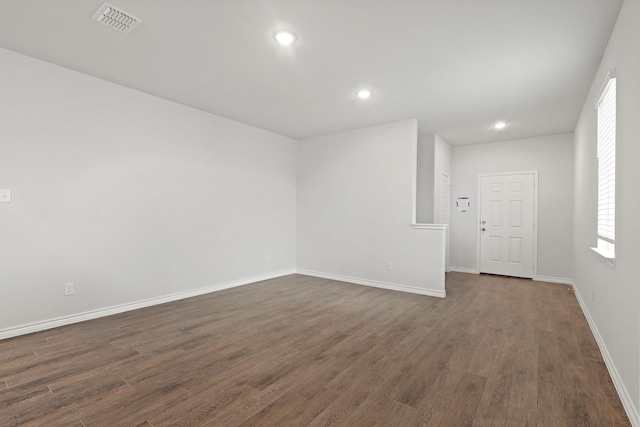 2433 Dahlia Dr, Fort Worth, TX 76123 - empty room featuring dark wood finished floors, baseboards, and recessed lighting