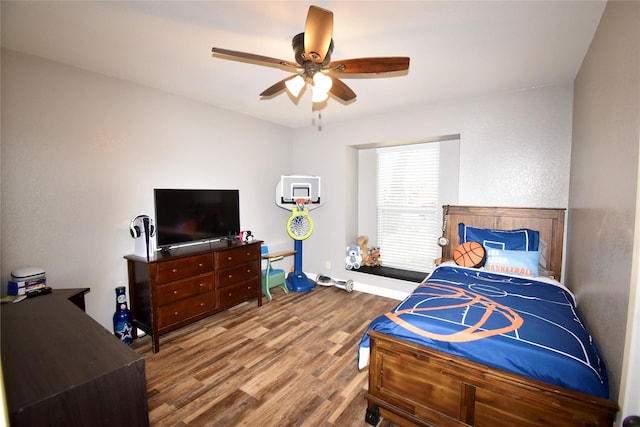 bedroom with wood finished floors and ceiling fan