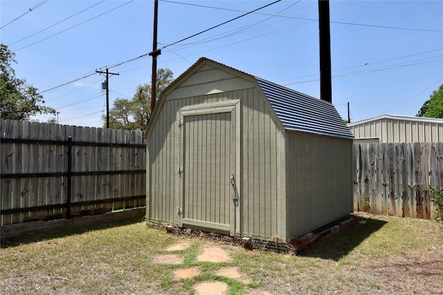 view of shed featuring a fenced backyard
