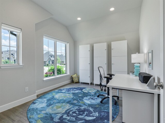 carpeted bedroom featuring lofted ceiling, ensuite bath, baseboards, and ceiling fan