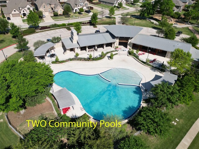 birds eye view of property with a residential view