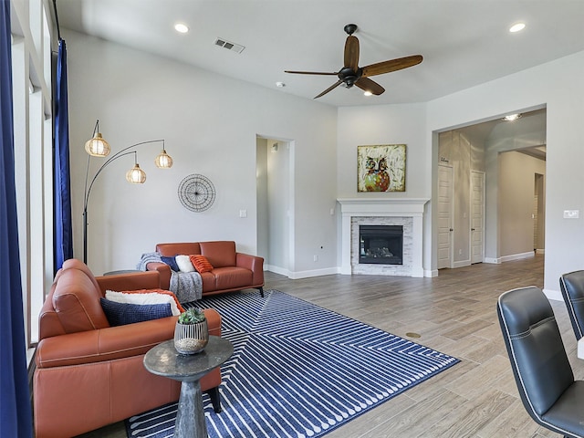 8901 Brandy Branch Way, Mckinney, TX 75071 - living area with a ceiling fan, wood finished floors, a glass covered fireplace, recessed lighting, and baseboards