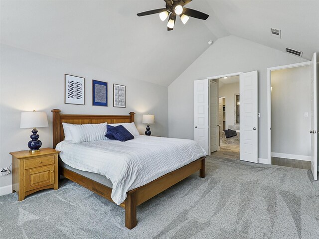 bedroom with light carpet, vaulted ceiling, visible vents, and baseboards