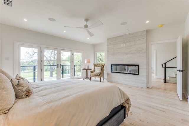 bedroom with french doors, light wood-style flooring, access to outside, visible vents, and recessed lighting