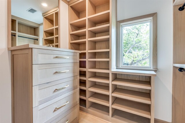 walk in closet featuring visible vents