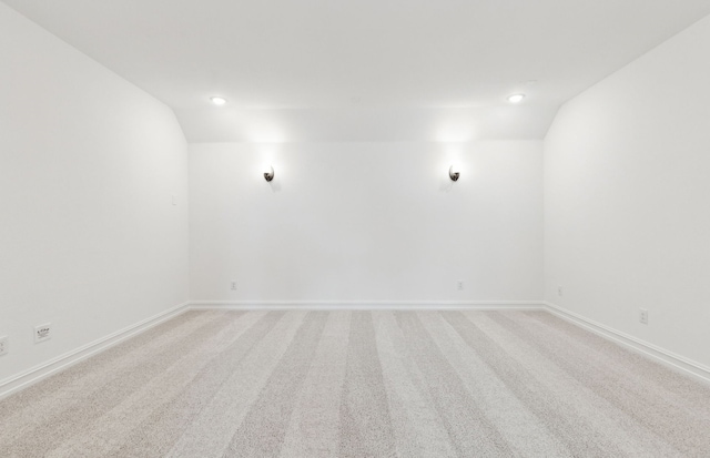11205 Boyne Ave, Fort Worth, TX 76052 - empty room with vaulted ceiling, light carpet, baseboards, and recessed lighting