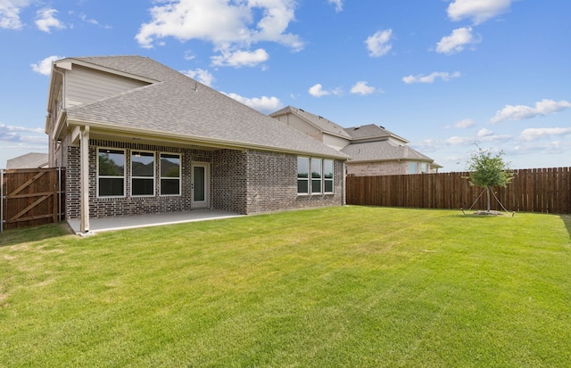 11205 Boyne Ave, Fort Worth, TX 76052 - back of property featuring a shingled roof, brick siding, and a patio area