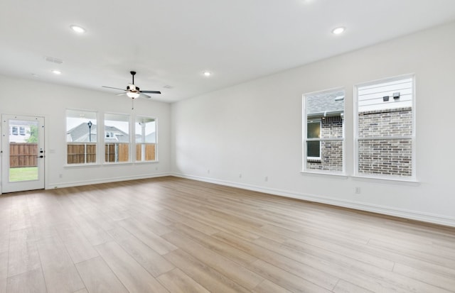11205 Boyne Ave, Fort Worth, TX 76052 - unfurnished living room with healthy amount of natural light, light wood-style floors, ceiling fan, and recessed lighting