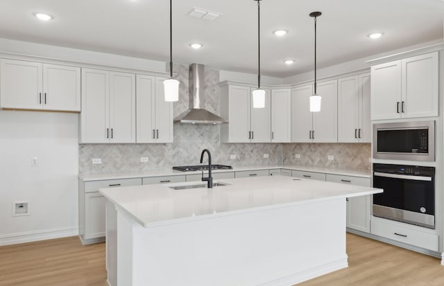 11205 Boyne Ave, Fort Worth, TX 76052 - kitchen with stainless steel oven, wall chimney exhaust hood, built in microwave, light wood finished floors, and recessed lighting