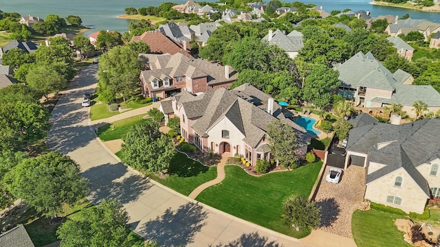 bird's eye view with a residential view and a water view