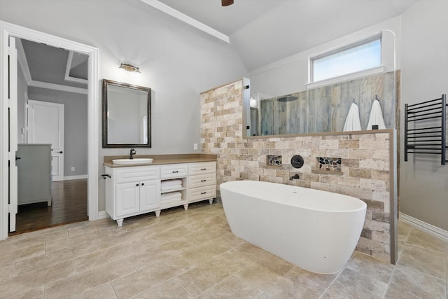 full bath featuring a walk in shower, vanity, a soaking tub, a ceiling fan, and lofted ceiling