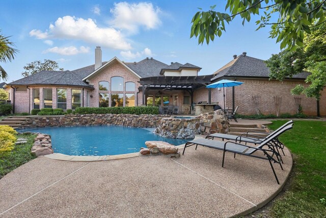 outdoor pool featuring a pergola, a patio, and exterior bar