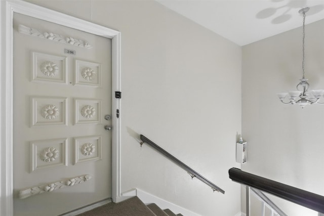 4320 Bellaire Dr S Unit 206W, Fort Worth, TX 76109 - staircase with baseboards and a chandelier