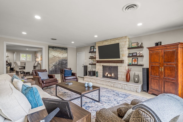 living area featuring visible vents, recessed lighting, and ornamental molding