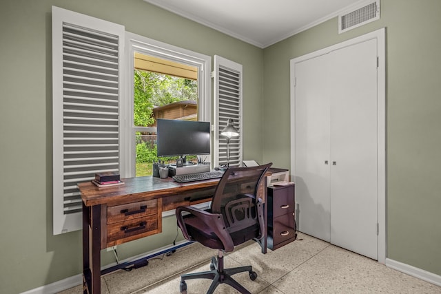 office area with baseboards, ornamental molding, speckled floor, and visible vents
