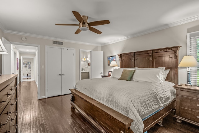 bedroom with visible vents, crown molding, dark wood-style flooring, ceiling fan, and connected bathroom