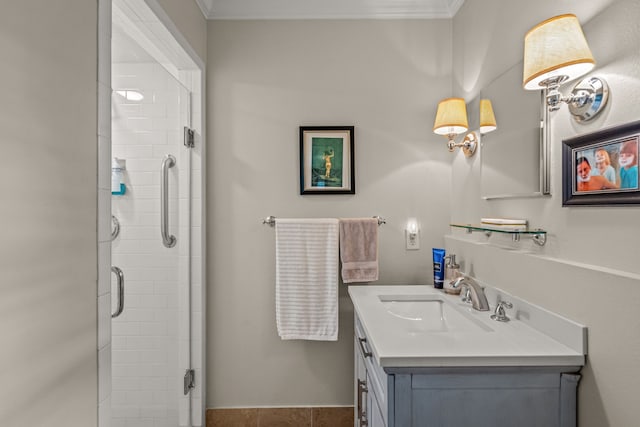 full bathroom with vanity, ornamental molding, and a stall shower