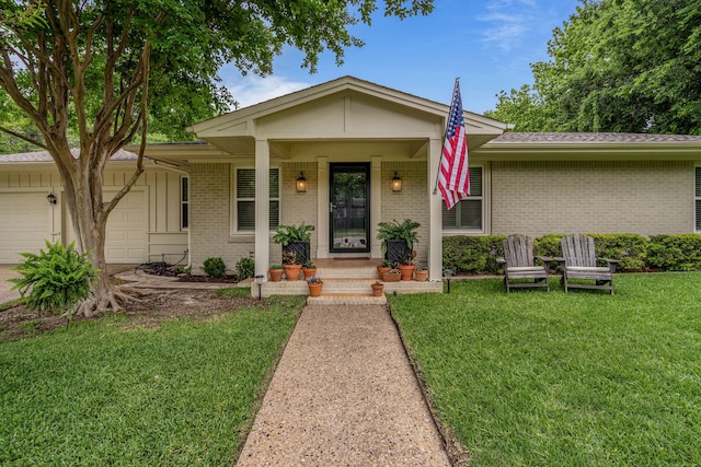 single story home featuring an attached garage, a front lawn, and brick siding