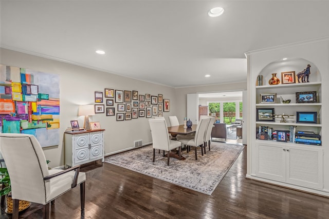 dining space with crown molding, recessed lighting, baseboards, wood finished floors, and visible vents