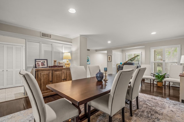 dining area with recessed lighting, visible vents, ornamental molding, and wood finished floors