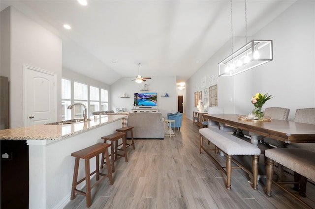 616 Chippewa Way, Aubrey, TX 76227 - dining space with light wood finished floors, ceiling fan, lofted ceiling, and recessed lighting