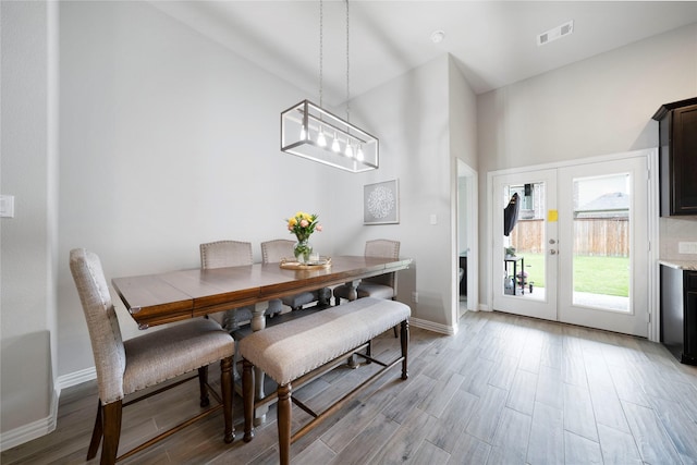 616 Chippewa Way, Aubrey, TX 76227 - dining room with light wood-style flooring, baseboards, french doors, and a chandelier