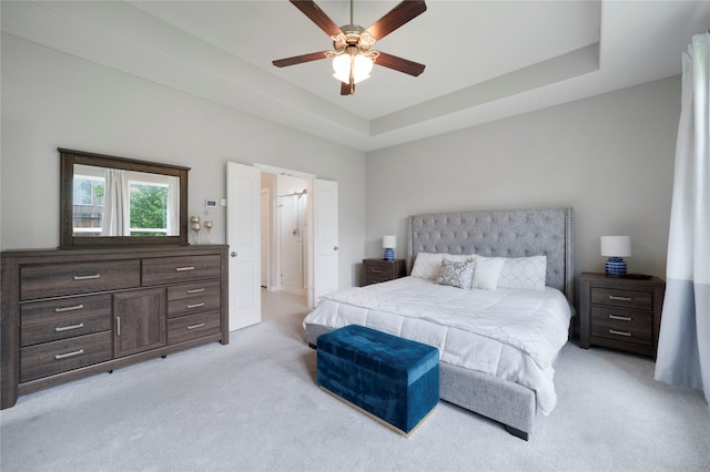 616 Chippewa Way, Aubrey, TX 76227 - bedroom with light carpet, a raised ceiling, and ceiling fan
