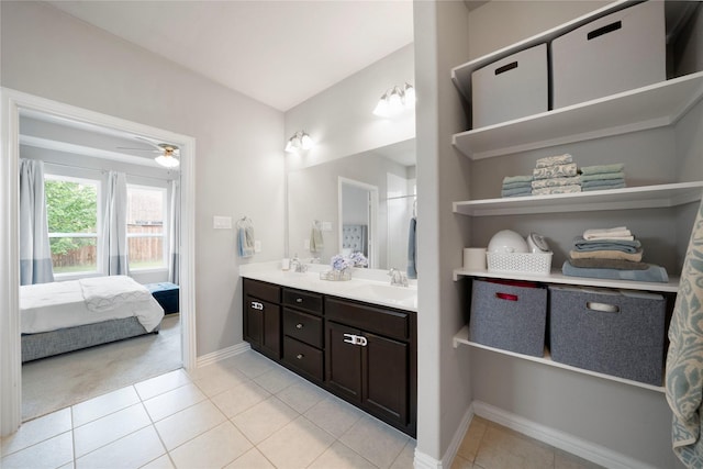 616 Chippewa Way, Aubrey, TX 76227 - ensuite bathroom with double vanity, tile patterned floors, baseboards, and a ceiling fan