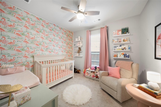 616 Chippewa Way, Aubrey, TX 76227 - bedroom featuring carpet floors, a nursery area, wallpapered walls, ceiling fan, and baseboards