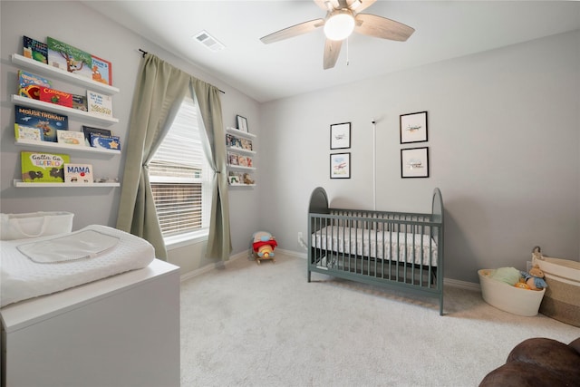 616 Chippewa Way, Aubrey, TX 76227 - carpeted bedroom featuring a nursery area, baseboards, and a ceiling fan