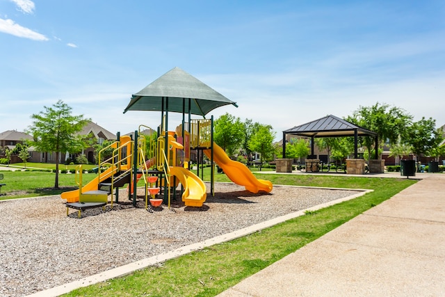 community play area with a lawn and a gazebo