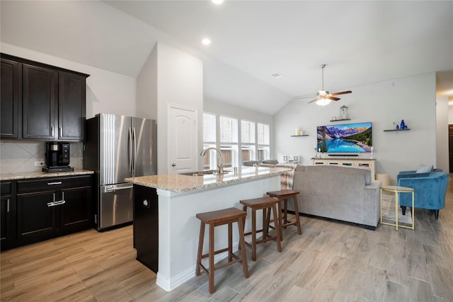 616 Chippewa Way, Aubrey, TX 76227 - kitchen with freestanding refrigerator, a sink, open floor plan, vaulted ceiling, and a ceiling fan