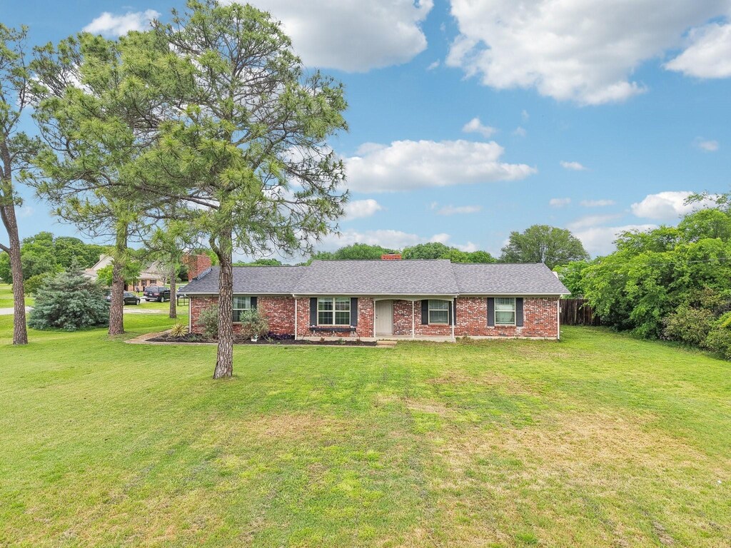 603 Fm 407 E, Argyle, TX 76226 - ranch-style house with a chimney, brick siding, and a front yard