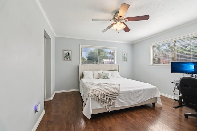 bedroom with ceiling fan, baseboards, crown molding, and wood finished floors