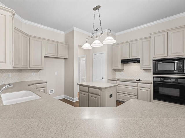 kitchen with under cabinet range hood, a sink, black appliances, and tasteful backsplash