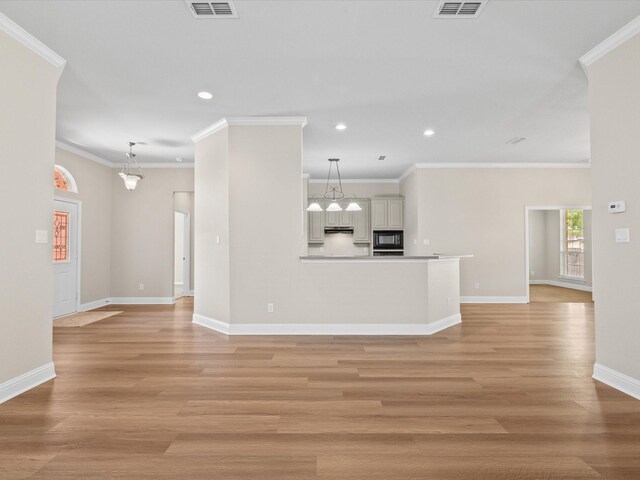 unfurnished living room with recessed lighting, light wood-style flooring, visible vents, and baseboards