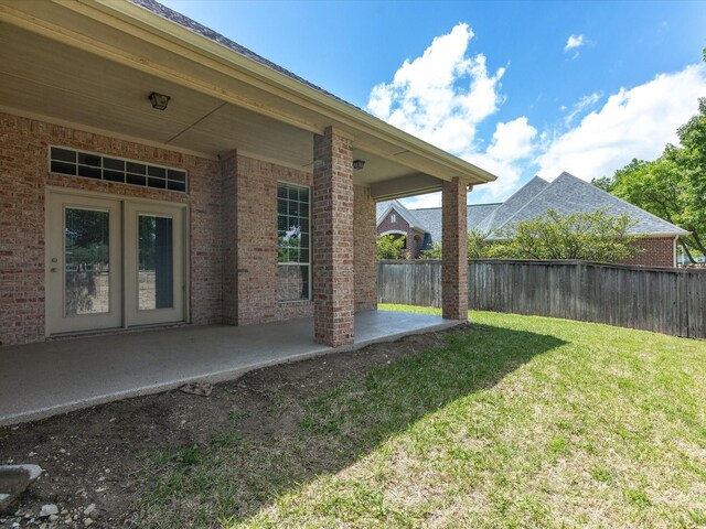 view of yard featuring fence and a patio area